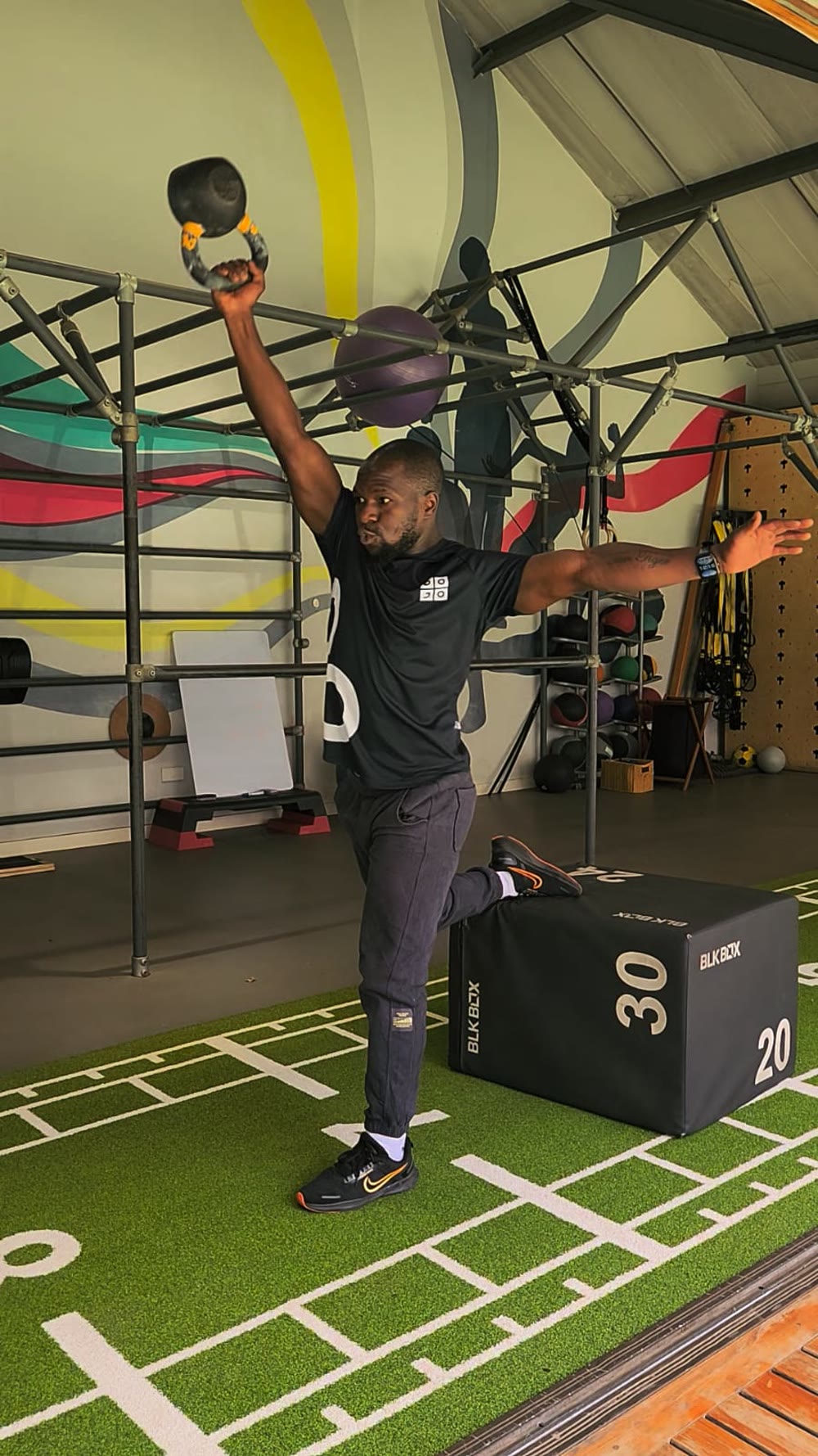 Tim locking out a kettlebell snatch overhead